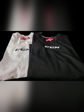 CCM Youth XL Black and White GOALIE CUT Hockey Jerseys